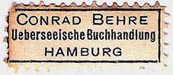 Conrad Behre, Ueberseeische Buchhandlung, Hamburg, Germany (approx 29mm x 12mm). Courtesy of Michael Kunze.